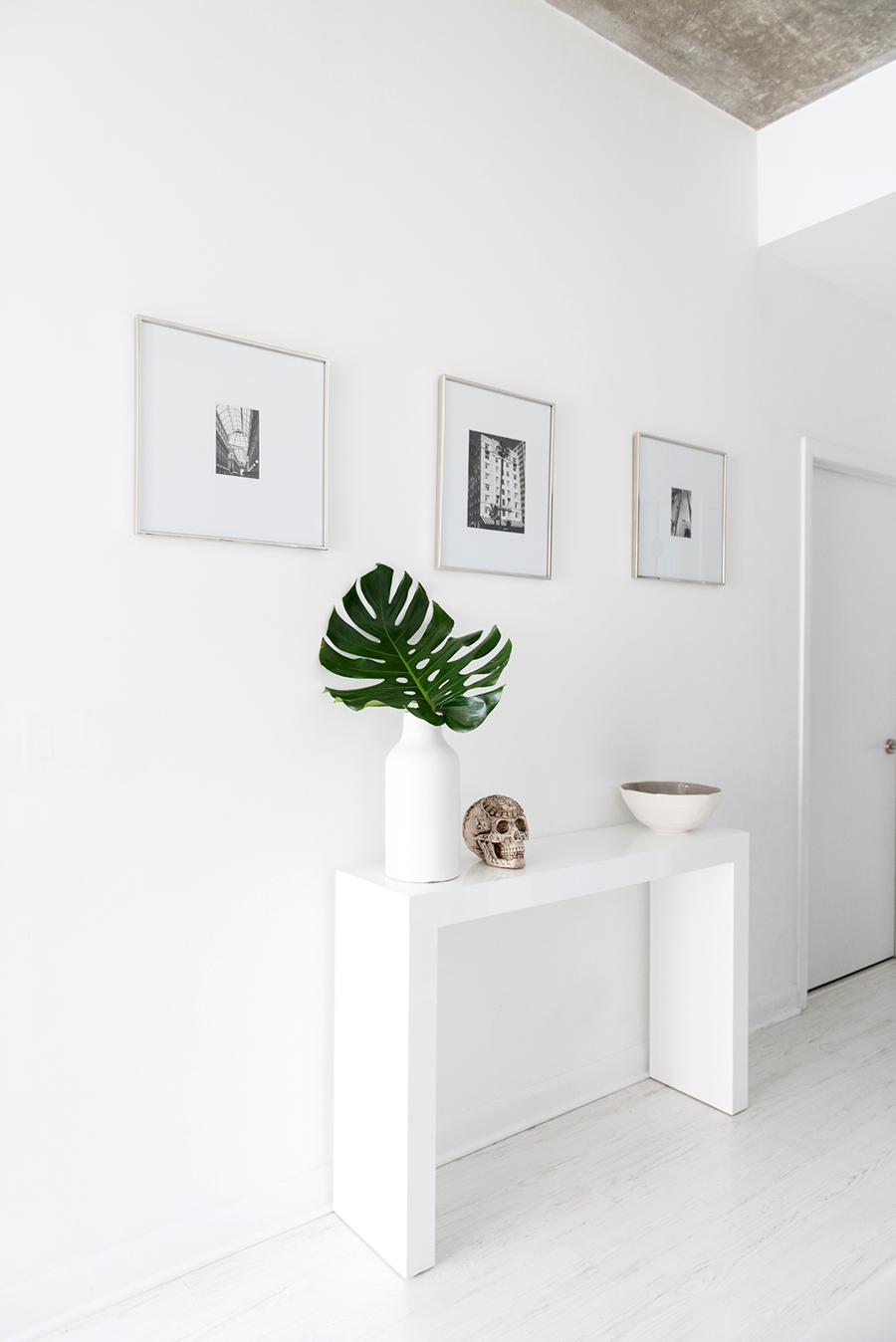 home office reveal blogger kayla seah not your standard pretty stylish chic white decor black  clean simple modern small space workspace desk inspiration fashion style work shelving structube west elm